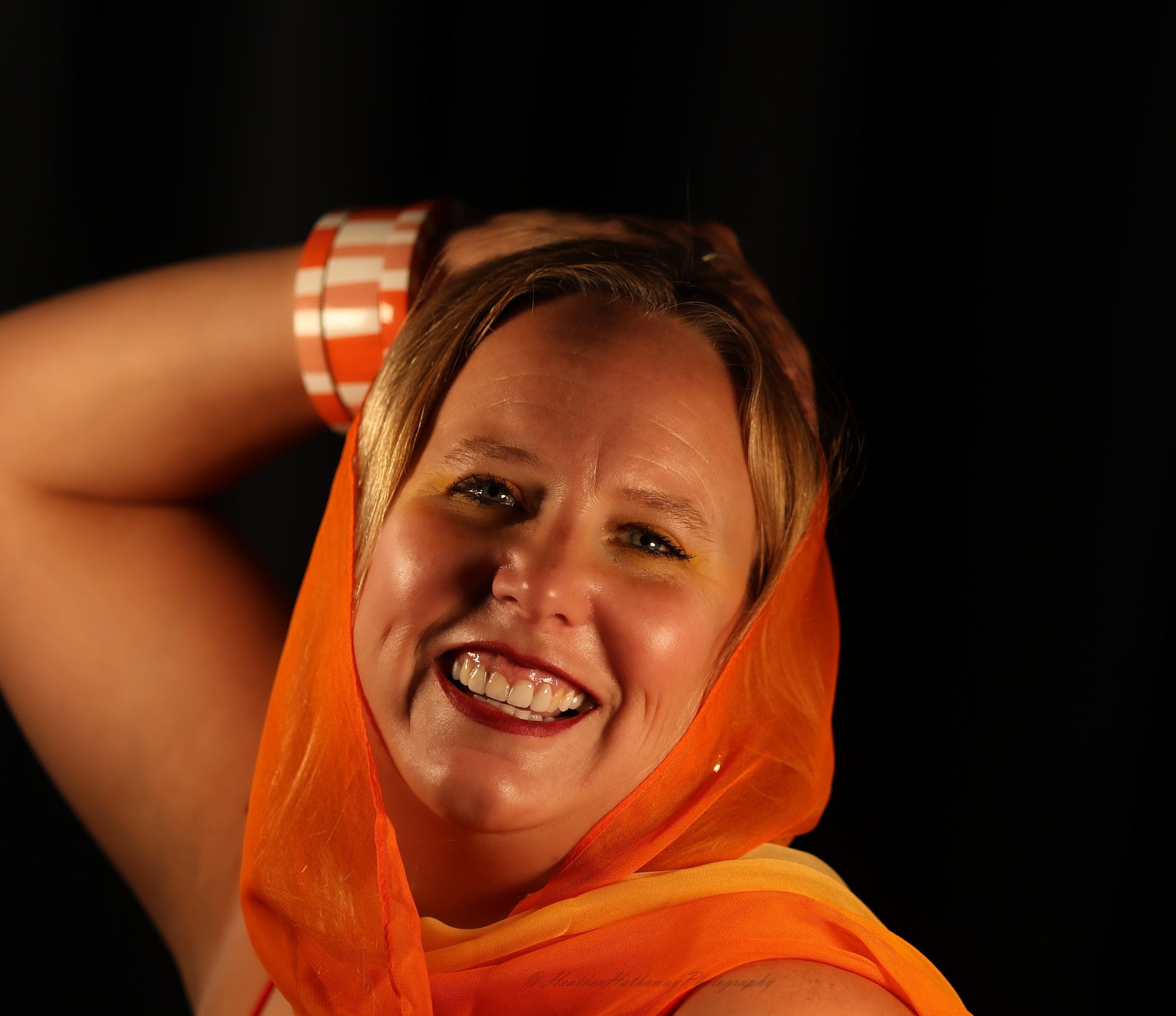 HeatherHathawayinOrange Photographer Heather Hathaway poses in orange.