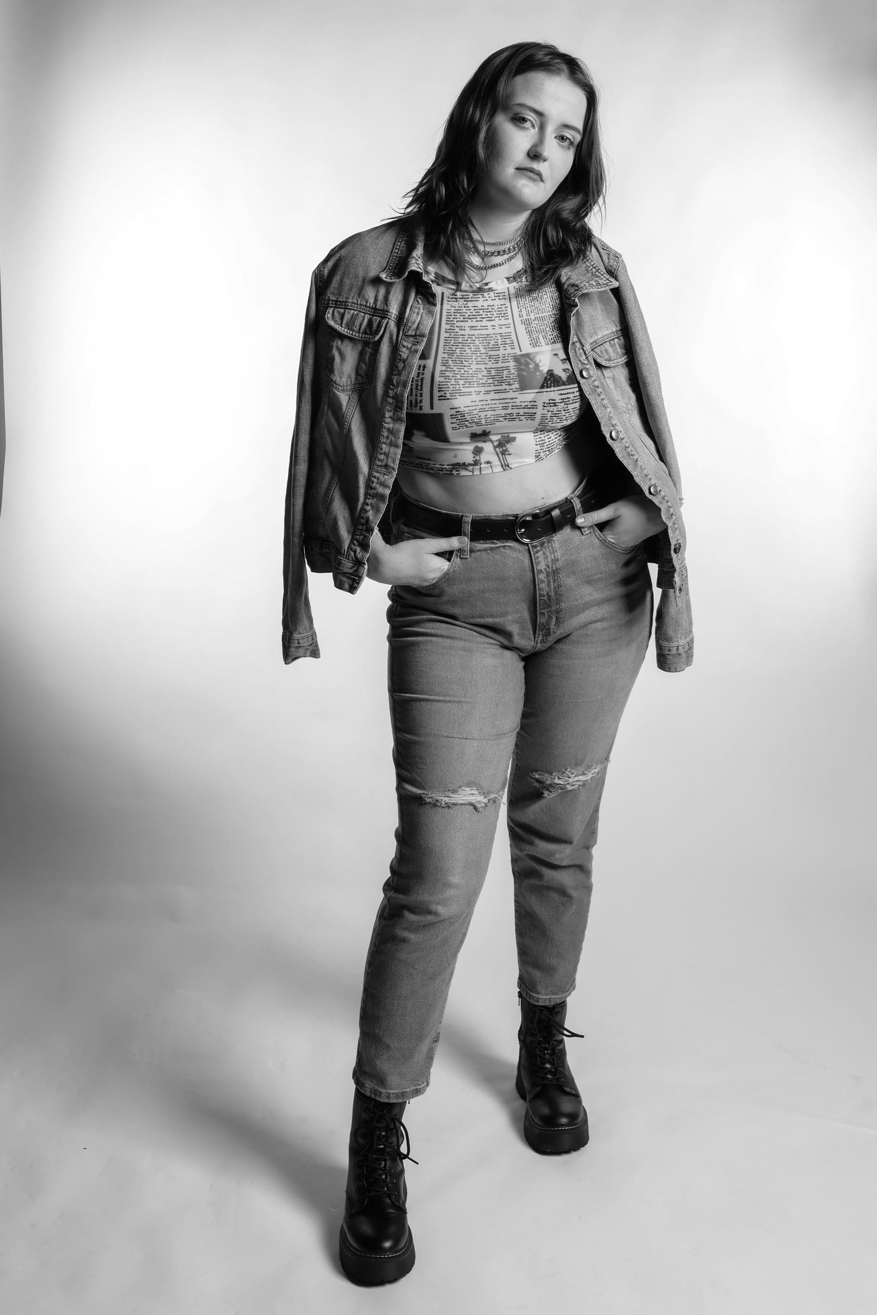 Musician in Black and White A local musician poses with jean jacket draped over her shoulder in this black and white photo.