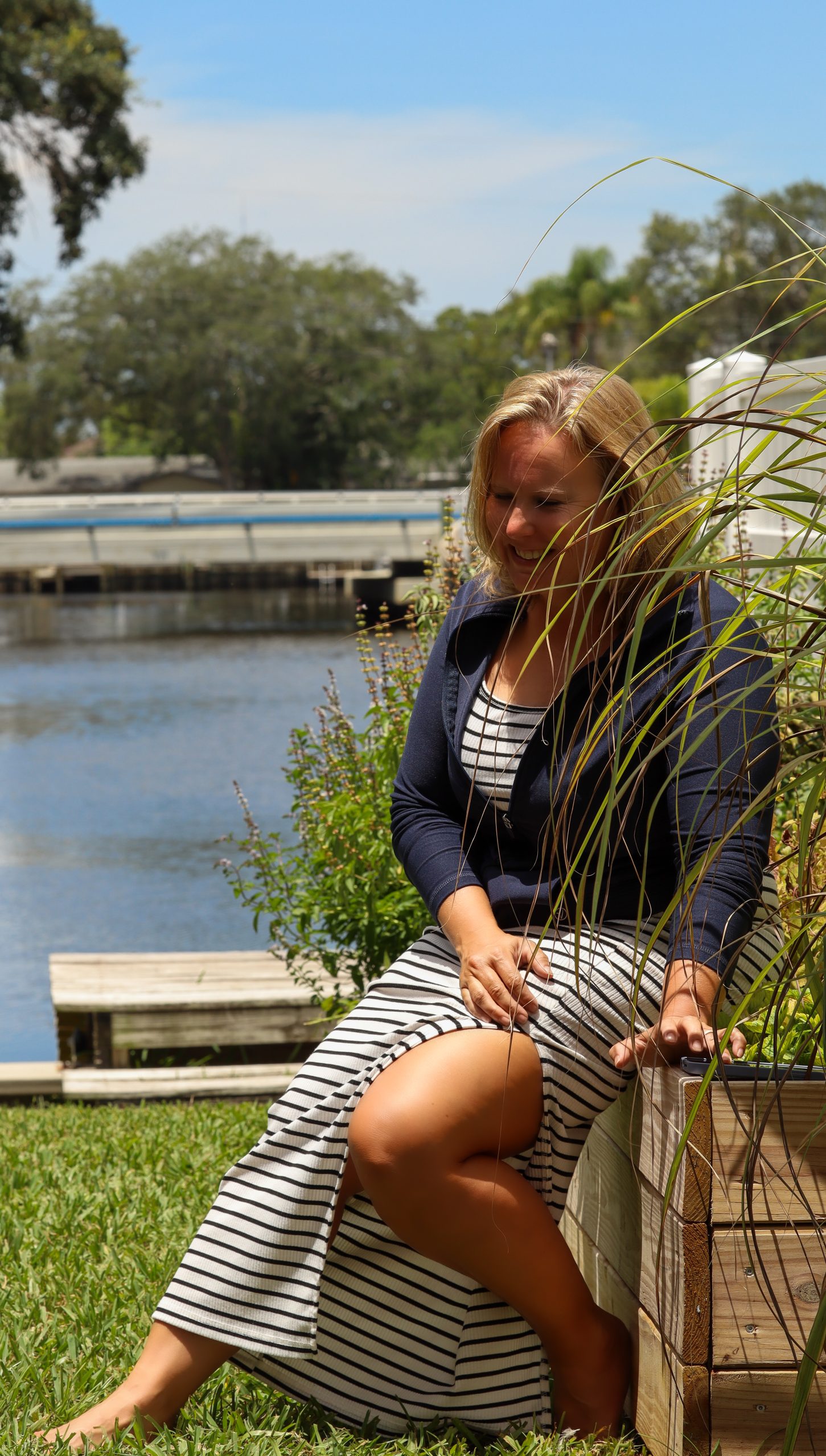 Photographer Heather Hathaway sits in her garden by the water in Palm Harbor contemplating all the beautiful moments she has captured for others.