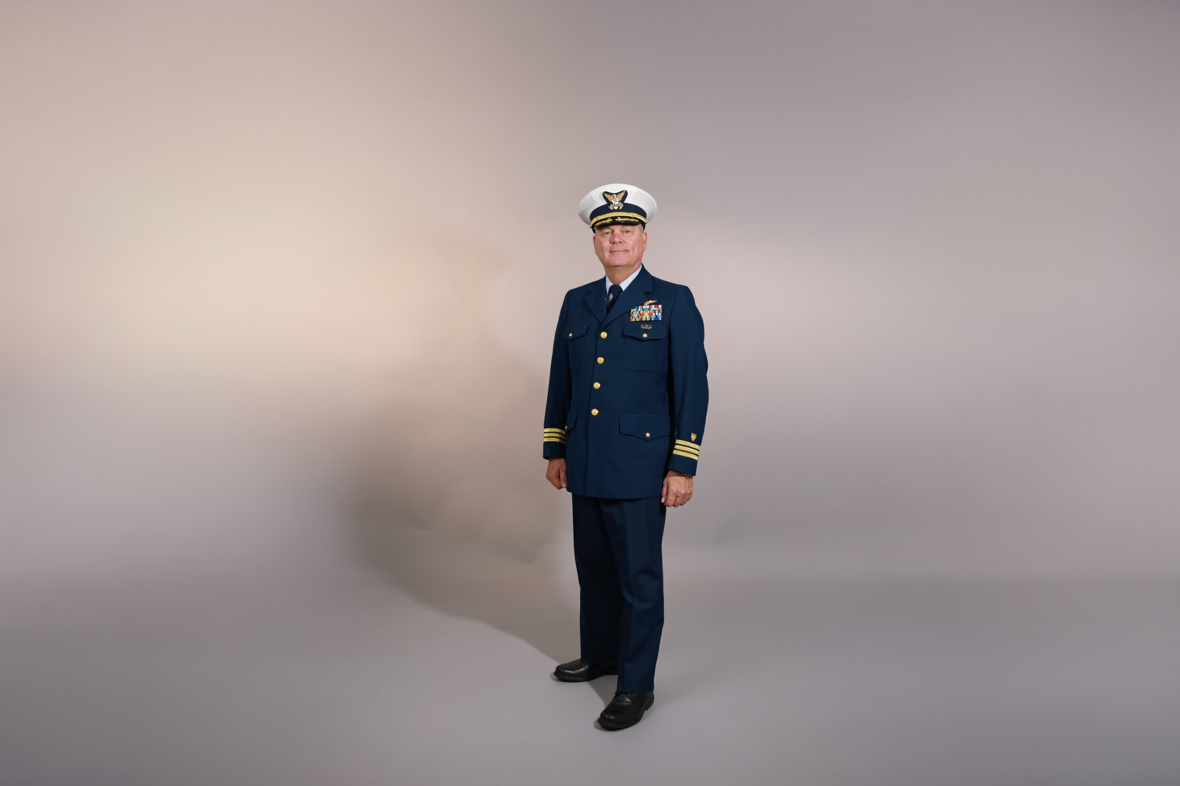 A congressional candidate poses in his military uniform for some branding photos.