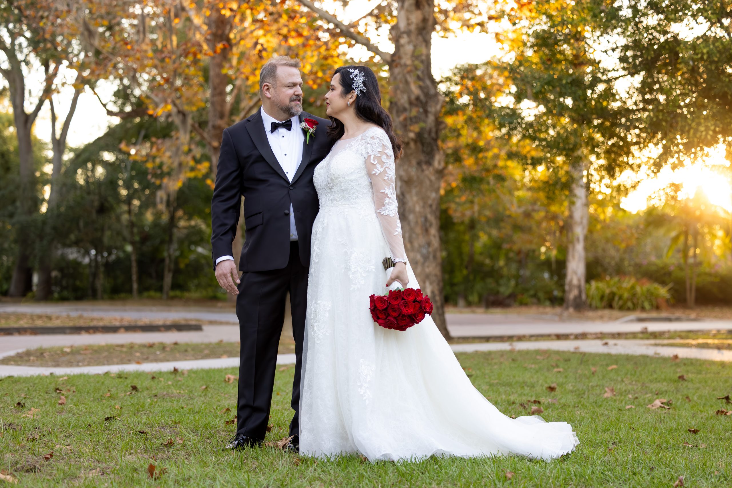 A couple poses in Mead Botanical Gardens, Orlando, Florida after their wedding ceremony.