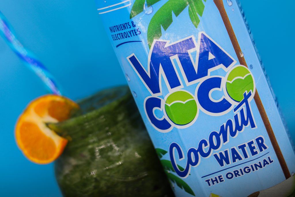 A Vita-Coco Coconut Water makes a delicious kiwi - green energy smoothie.